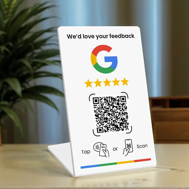 Supplier reference showing a white countertop review stand with NFC and QR prompts